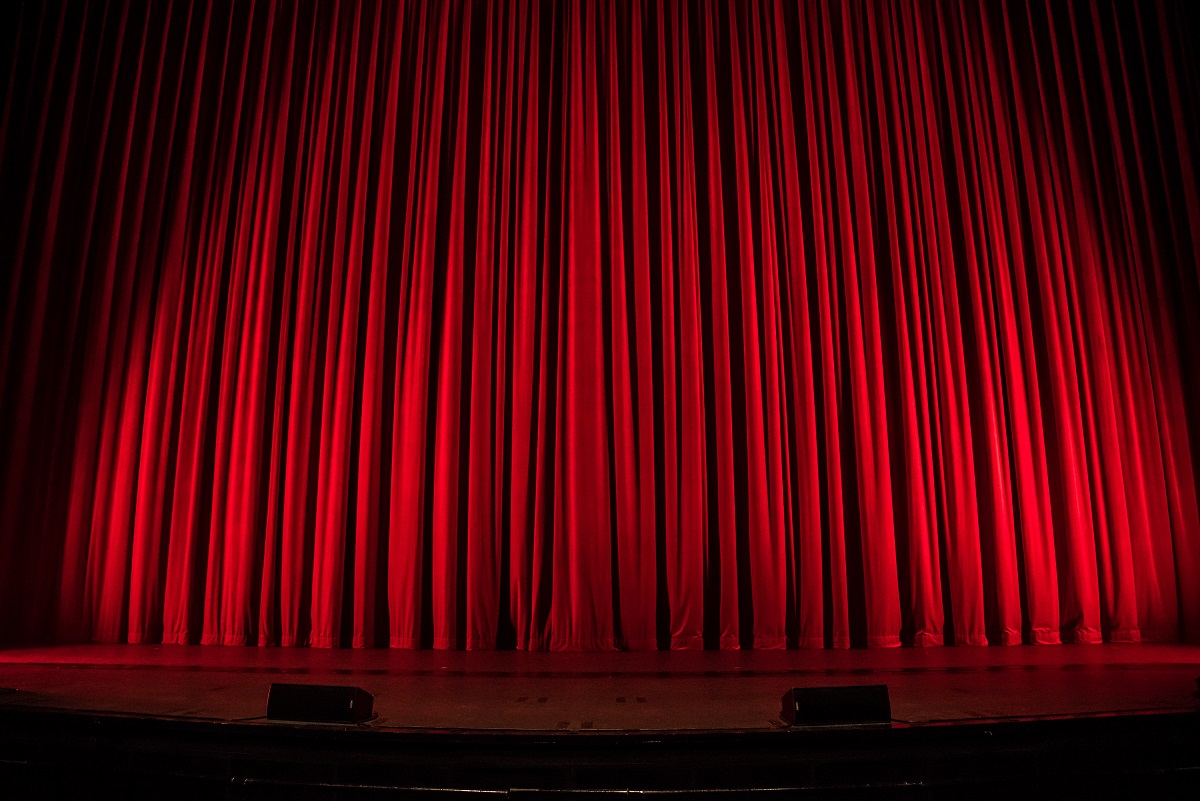 heavy red curtains in the theater