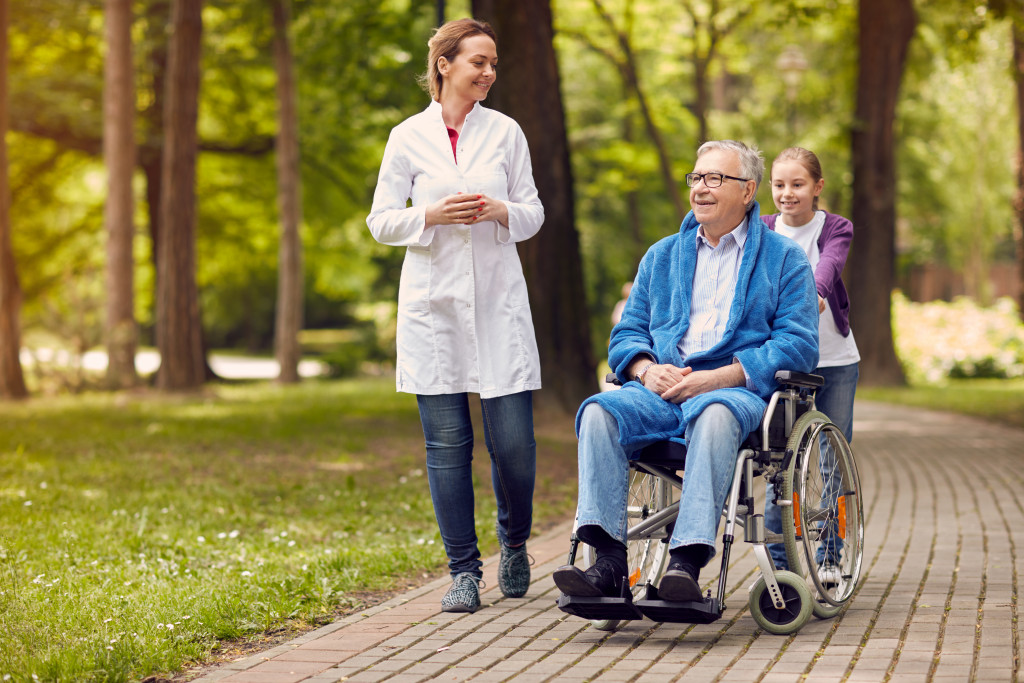 caregiver nurse and granddaughter outdoor